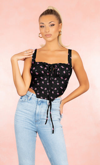 Sweet Mystery Black Floral Pattern Ruched Sleeveless Tie Front Bustier Asymmetric Hem Crop Top